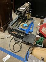 Rockwell 10-inch radial saw showing base, arm with saw blade, and motor