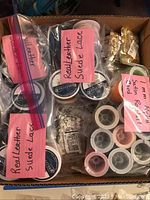 Overhead view of a box with multiple labeled ziplock bags containing real leather suede lace and other supplies