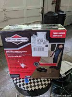Box of Briggs & Stratton rotating surface cleaner attachment for power washer, showing brand logo and product features.