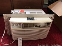 Frigidaire window air conditioner unit front view showing the full unit, power cord, and installation brackets.