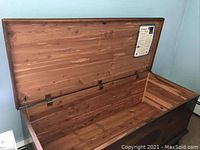 Open view of Lane Hope Cedar Chest showing interior cedar wood lining and wear on exterior wood surface.