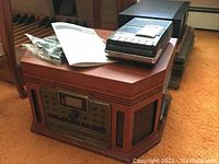 Overview of the Crowley Radio CR248 songwriter and CD recorder with instruction manual and cables on top showing the lot's set up and condition.