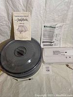 Overview showing FoodSaver vacuum sealer, food dehydrator with operating instructions, and hot air fryer.