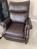 Front view of brown leather recliner
