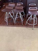 Group of six swivel stools