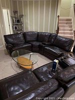 Sectional arranged in circular configuration in basement room