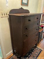 Side angle showing bureau height, structure, and side panels