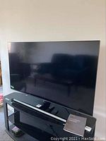 Front view of TV on stand
