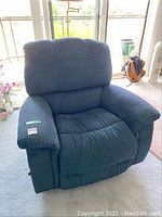 Front three-quarter view of blue recliner chair