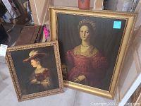 Both framed portraits shown next to each other, one larger than the other, with detailed gold frames.