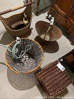 Three assorted baskets including woven and coarse material types, a copper coal scuttle with ceramic handle, and a brass duck figurine among other decor items.