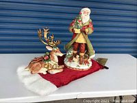 Front view of Santa and reindeer on red fabric