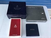 Four boxed porcelain and bone china items from Spode, Bjorn Wiinblad, Royal Albert, and Eaton's shown unopened in boxes.