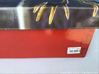 Box showing Fitz & Floyd monogram on black and red packaging with barcode