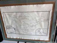 Full view of framed map showing entire map within wooden frame with glass.