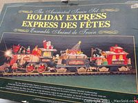 Original box showing the Holiday Express animated train set with festive train cars and holiday decorations.