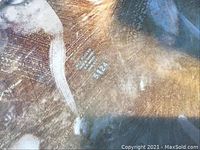 Close-up photo showing stamped mark on silver plated platter bottom reading 'REED & BARTON STERLING 5124'