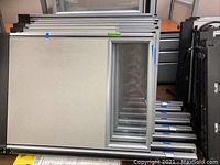 Panels stacked horizontally showing beige fabric surface and metal framing