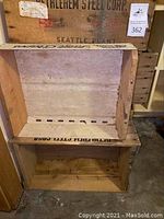 Two wooden crates stacked, one labeled Bethlehem Steel Corp Seattle Plant, other partially visible.