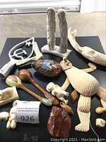 Overview of lot on black tabletop showing all items