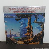 Front cover of Anderson Bruford Wakeman Howe vinyl album showing surreal landscape artwork