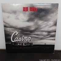 Front cover of Blue Rodeo Casino vinyl album with black and white photo and title.