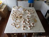 Overview of all Royal Albert Old Country Roses pieces arranged on table