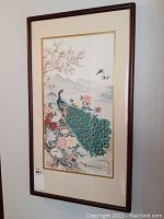 Full view of framed silk painting showing peacock on flowering branch and distant mountains