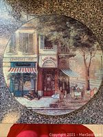Square glass tray with Parisian cafe scene showing storefronts Commerce-Vins and Cafe-Paris, table and chairs outdoors, trees and street setting