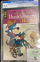 Front cover of Gold Key Huckleberry Hound #29 comic book graded 9.6 by CGC, featuring Huckleberry Hound on bicycle with Yakky Doodle character