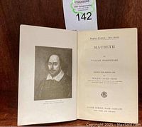 Open book showing the title page and frontispiece portrait of William Shakespeare labeled after the original Chandos portrait with text indicating English Classics - Star Series Macbeth edition by William Shakespeare, edited by Wilbur Lucius Cross and published by Globe School Book Company.