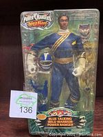 Front view of Power Rangers Wild Force Blue Talking Wild Warrior action figure in sealed blister pack with accessories visible.