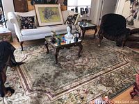 Full view of the rectangular Sorrento area rug under coffee table and sofa, showing its color, pattern and size.