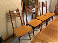 Four chairs front view showing upholstery and frames