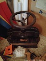 Dryad cast iron bookbinding press with handwheel and front metal plate.