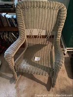 Wicker rocking chair showing front view and woven seat and back details.