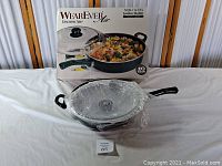 WearEver Air 5 Quart Jumbo Skillet with original box, skillet and glass lid wrapped in plastic.