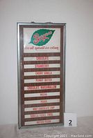 Full view of ice cream menu board with Breyers branding showing 10 flavor slots and a steel frame.