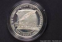 Close-up of the obverse side of the silver dollar showing 'The U.S. Constitution 200th Anniversary' and 'We the People' design.