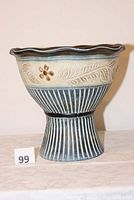 Photo of the full large footed planter showing its shape, colors, and patterns.