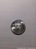 Clear top-down image showing the detailed flying Canada goose design and inscription: 'DOLLAR CANADA 1967 1967'. The coin appears shiny with minimal wear.