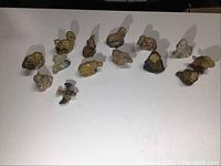 Top view of 14 Wade animal figurines arranged to show variety and detail.