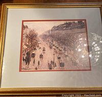 Frontal view of framed painting showing winter boulevard scene