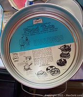 Close-up photos of the Regal Food Tote metal lid showing original printed paper insert with usage instructions and serving capacity (6 to 8 people).