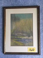 Full view of matted and framed pastel landscape