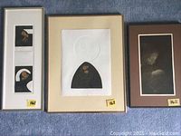 Three framed prints by M. Muleme laid out on blue carpet. Includes 'The Kiss', 'Maternity and Puberty' (framed together), and 'Mother and Child'.