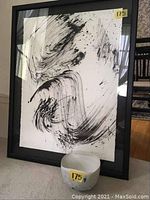 Full photo of framed pen and ink painting with ceramic bowl placed in front showing lot layout.