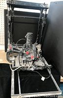 Wet tile saw mounted on gravity folding stand, showing overall condition and assembly