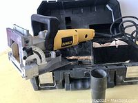 Plate joiner placed in open case showing main tool body and case interior