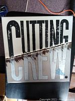 Front cover of Cutting Crew Broadcast vinyl album with large text design and distressed visual style.